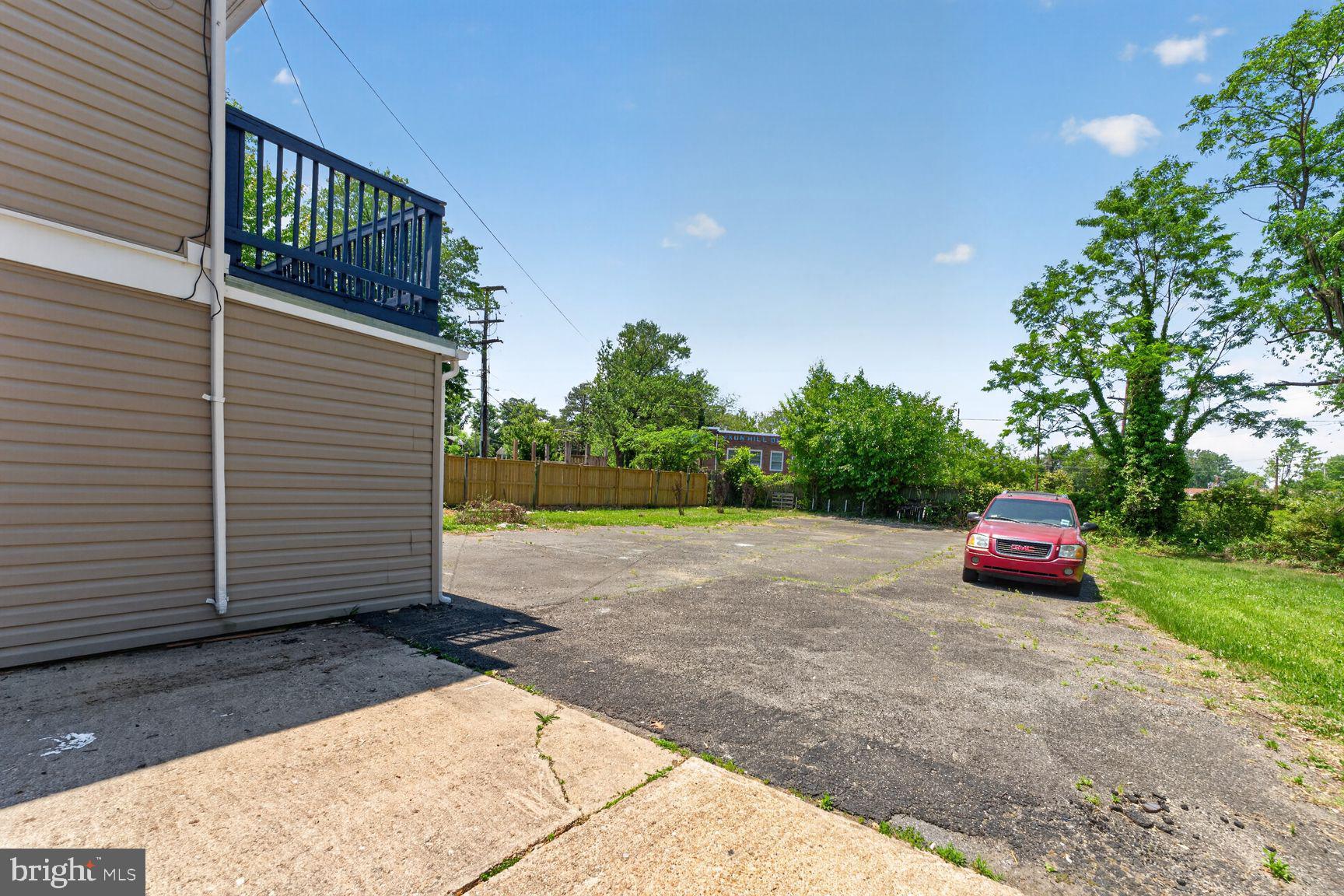 7205 Livingston Road Oxon Hill, MD 20745 - Photo 4 of 25 Spacious outdoor area with parking.