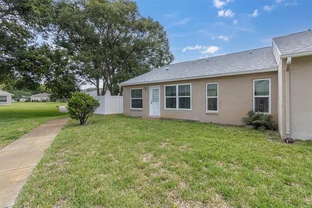 a view of a lake with houses in the back