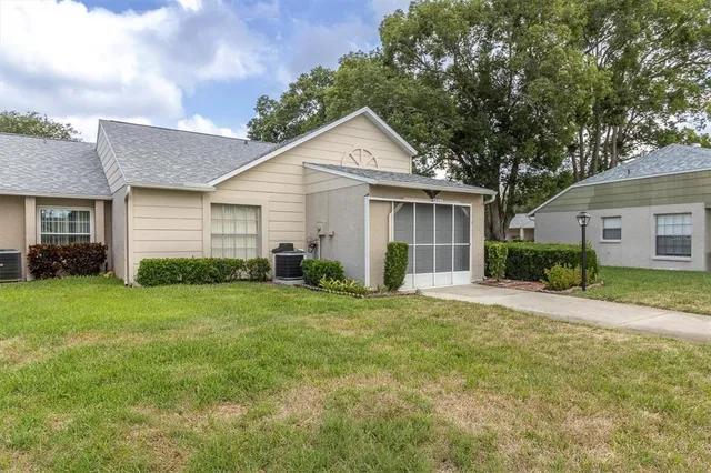 a view of a lake with houses in the back