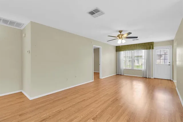 a view of an empty room with a window