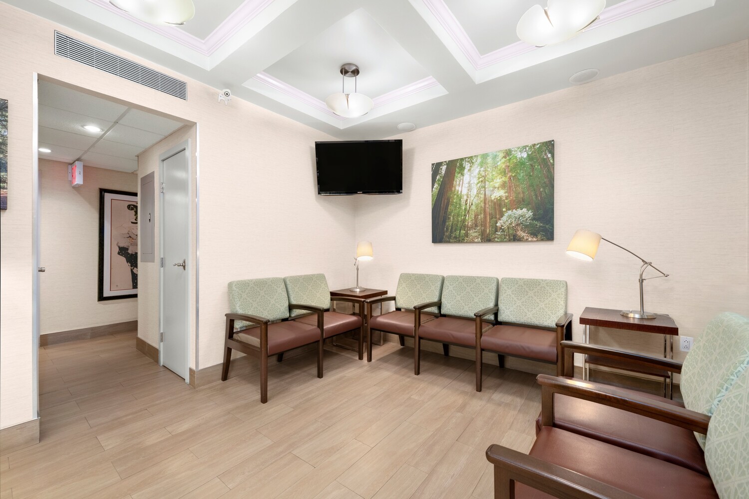 121 East 60th Street, Unit 3B Manhattan, NY 10022 - Photo 3 of 11 a living room with furniture and a flat screen tv