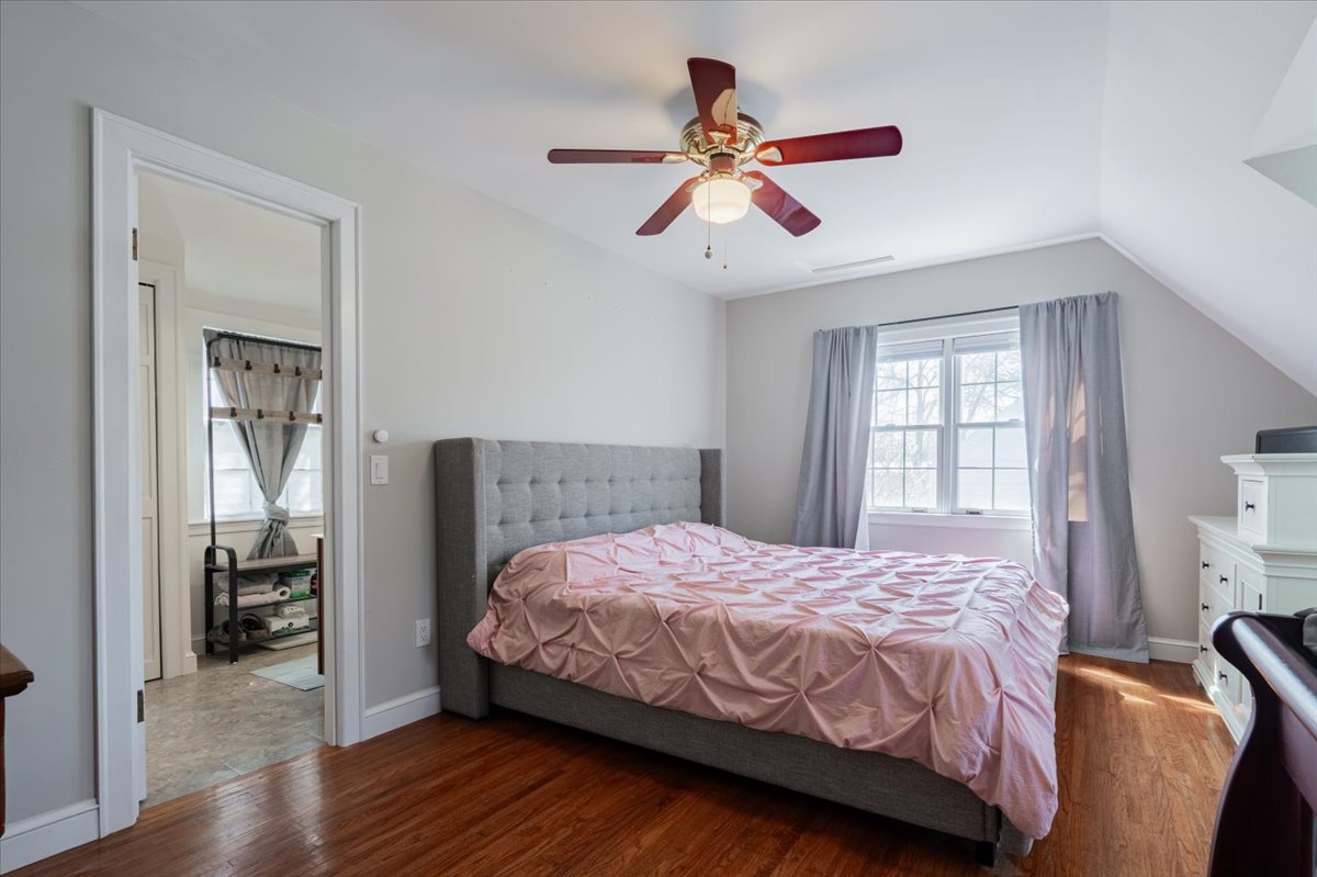 413 Grant Street Normal, IL 61761 - Photo 16 of 40 a bedroom with a bed and wooden floor