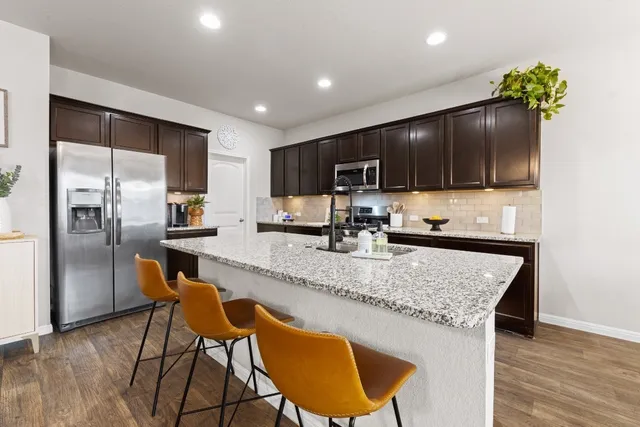 a kitchen with granite countertop counter top space cabinets and stainless steel appliances