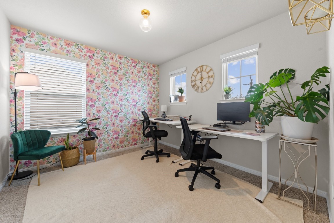 104 Blue Sage Drive Leander, TX 78641 - Photo 8 of 12 a view of a workspace with furniture and a window