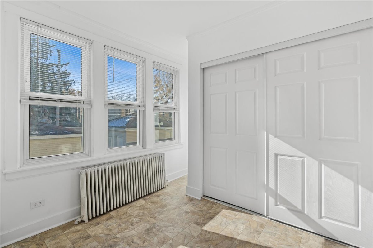5033 West Cullom Avenue, Unit 1 Chicago, IL 60641 - Photo 16 of 20 an empty room with windows