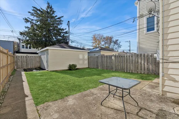 a view of a back yard of the house