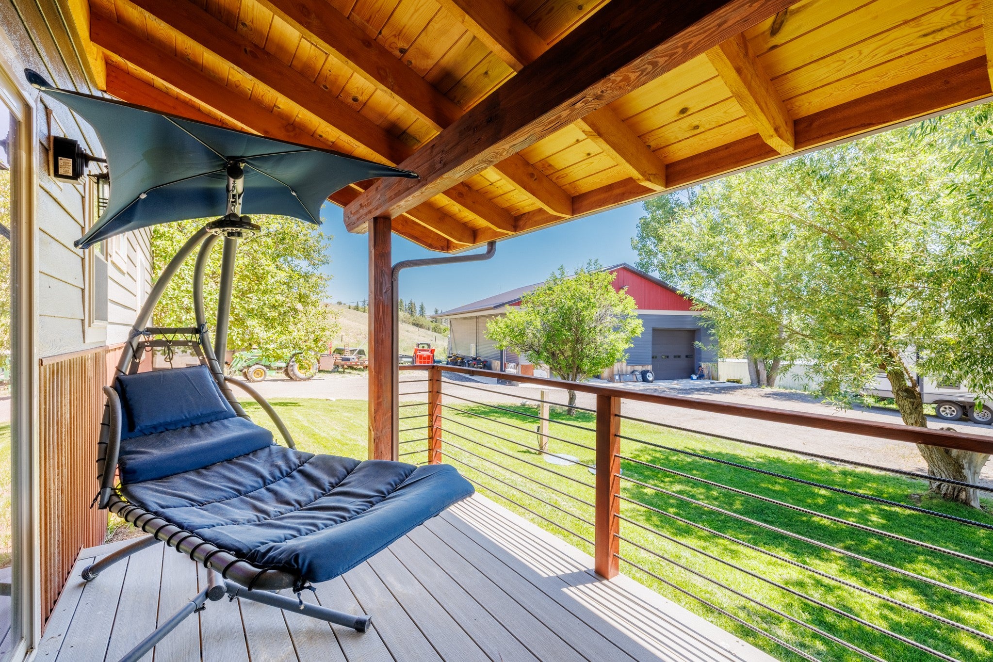 58 Gilman Road Garrison, MT 59731 - Photo 8 of 91 Wooden terrace with a lawn