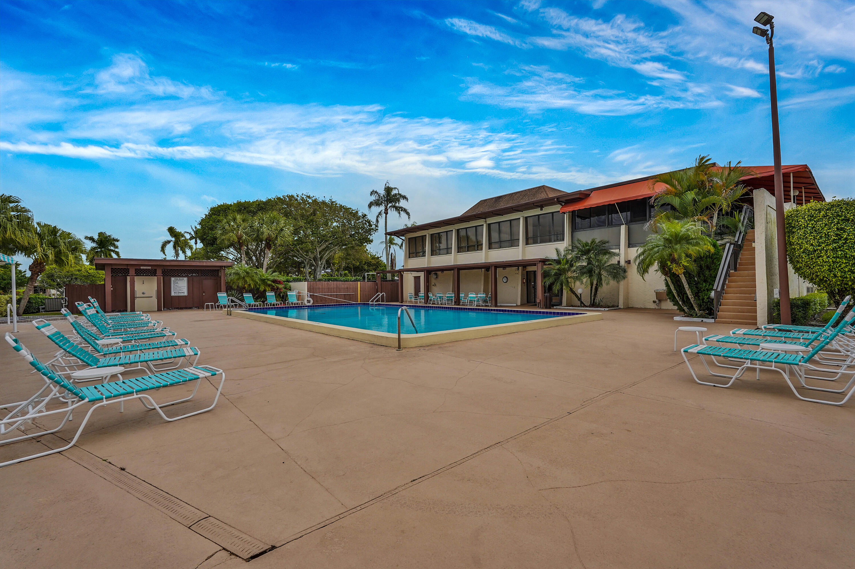 7512 Ace Road North Lake Worth, FL 33467 - Photo 18 of 25 a view of a chairs and table in the patio