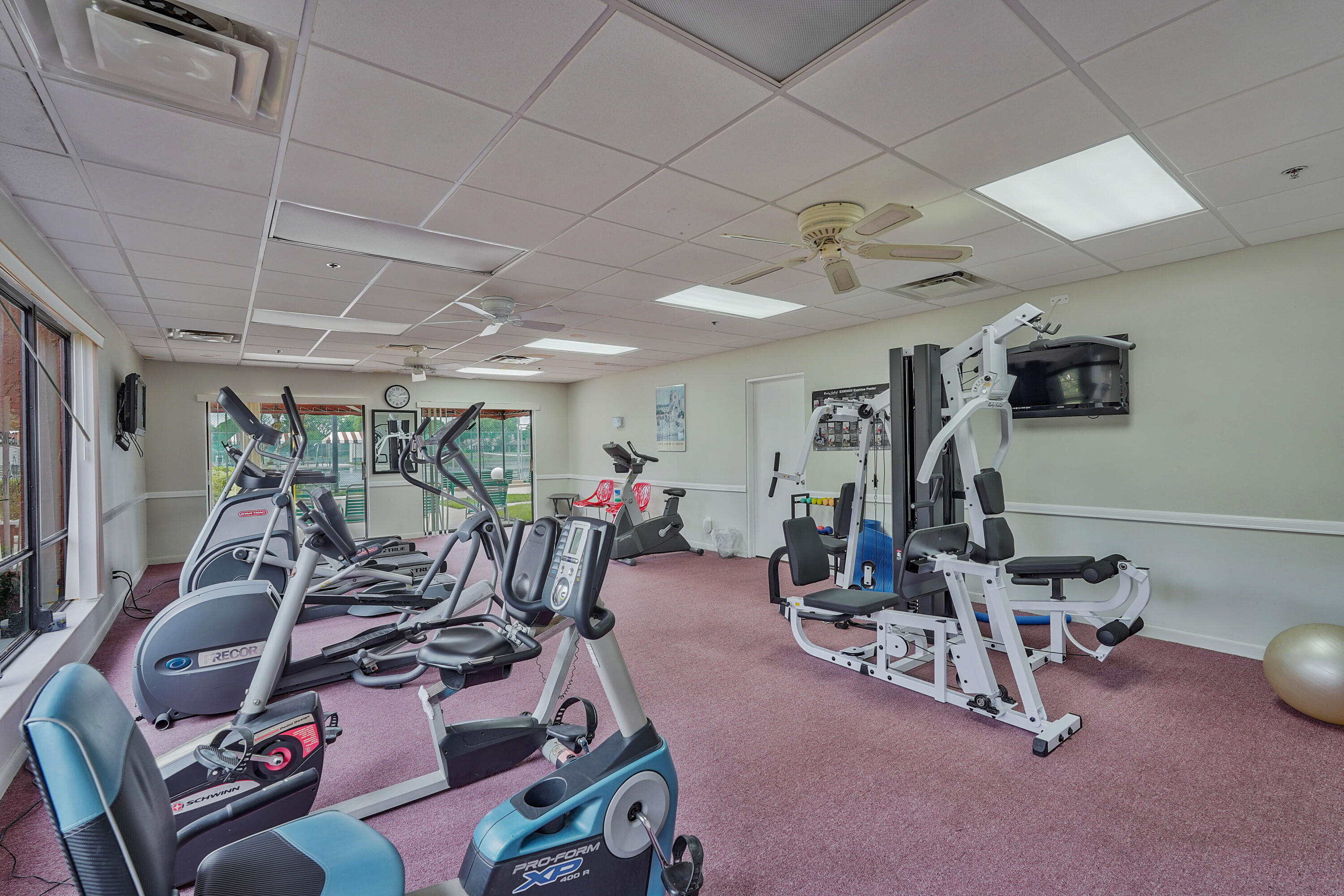 7512 Ace Road North Lake Worth, FL 33467 - Photo 19 of 25 a view of a room with gym equipment