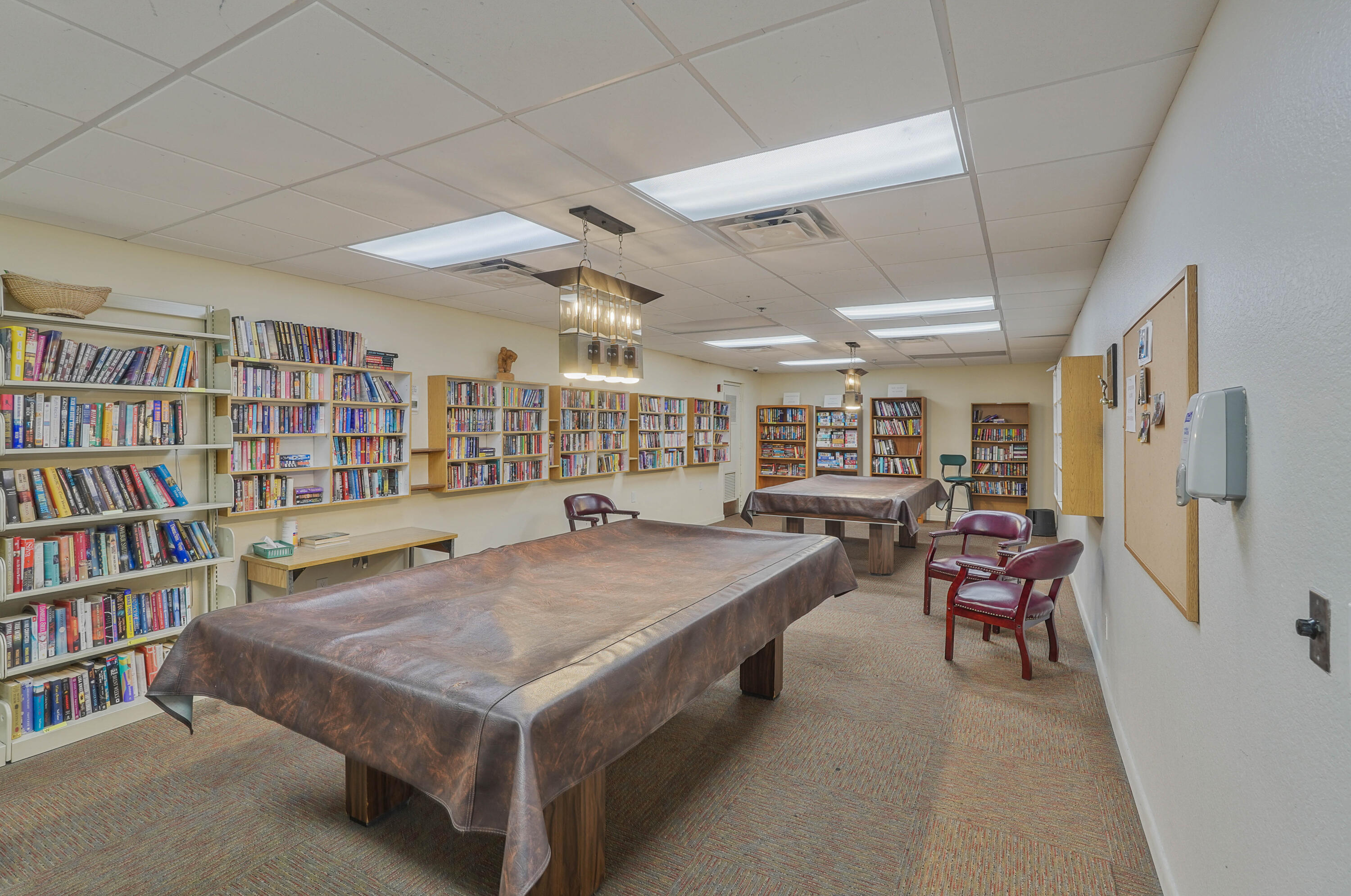 7512 Ace Road North Lake Worth, FL 33467 - Photo 24 of 25 a living room with furniture and a book shelf