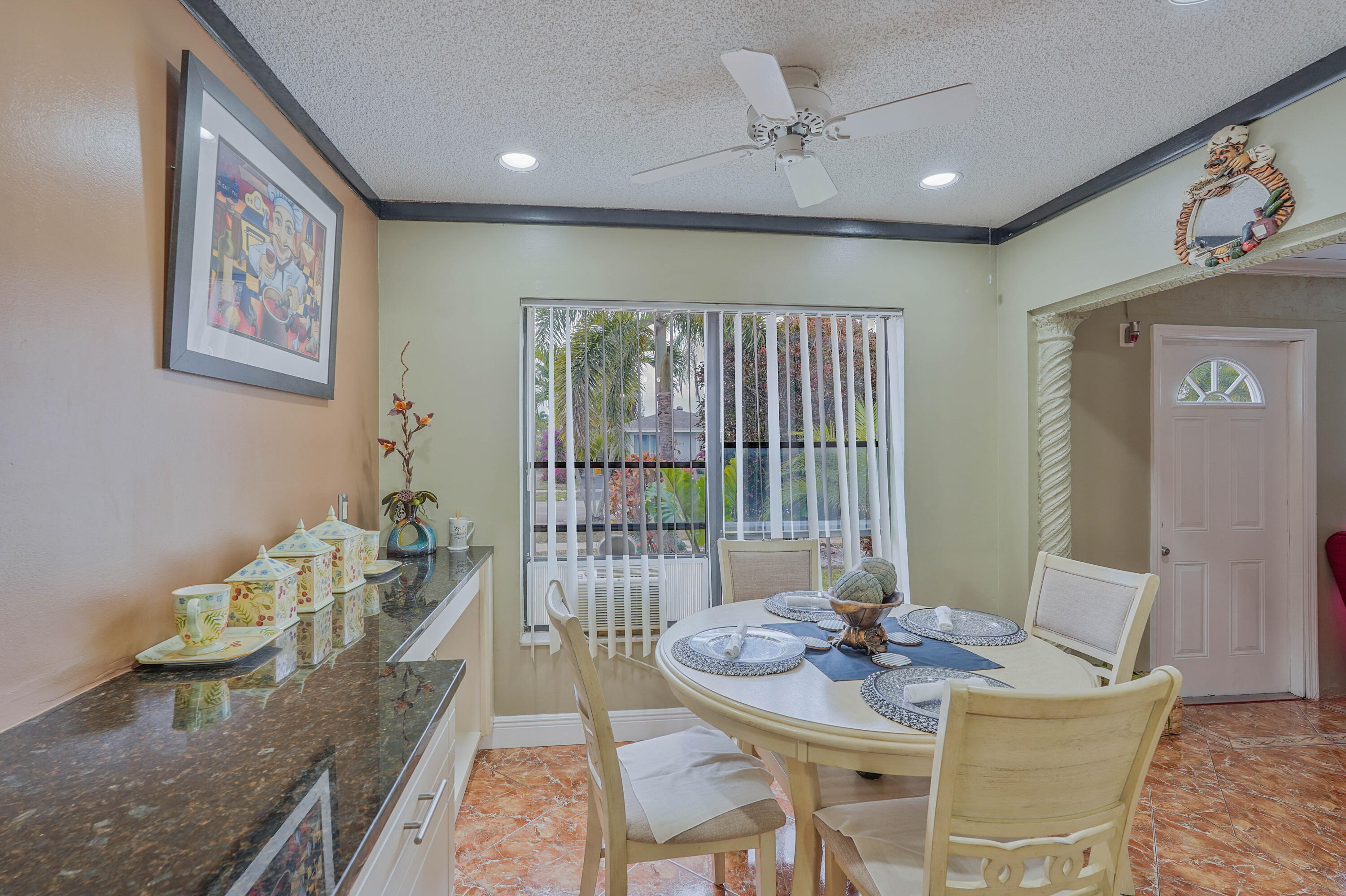 7512 Ace Road North Lake Worth, FL 33467 - Photo 6 of 25 a view of a dining room with furniture window and wooden floor