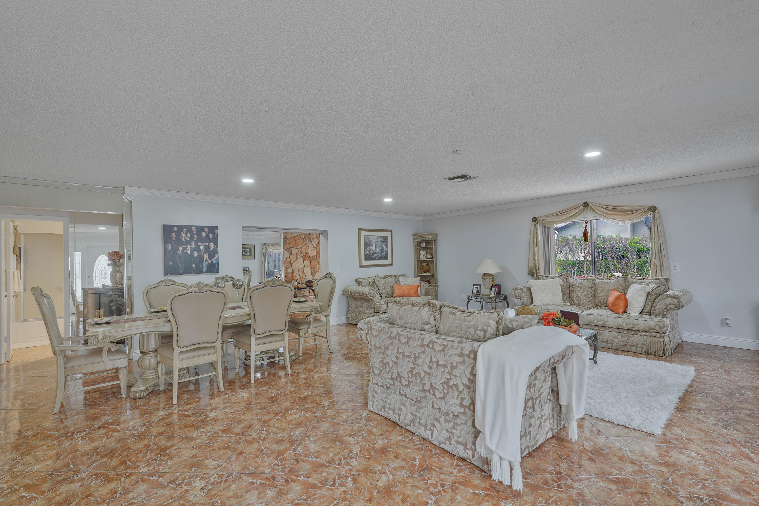 7512 Ace Road North Lake Worth, FL 33467 - Photo 7 of 25 a living room with furniture and a table