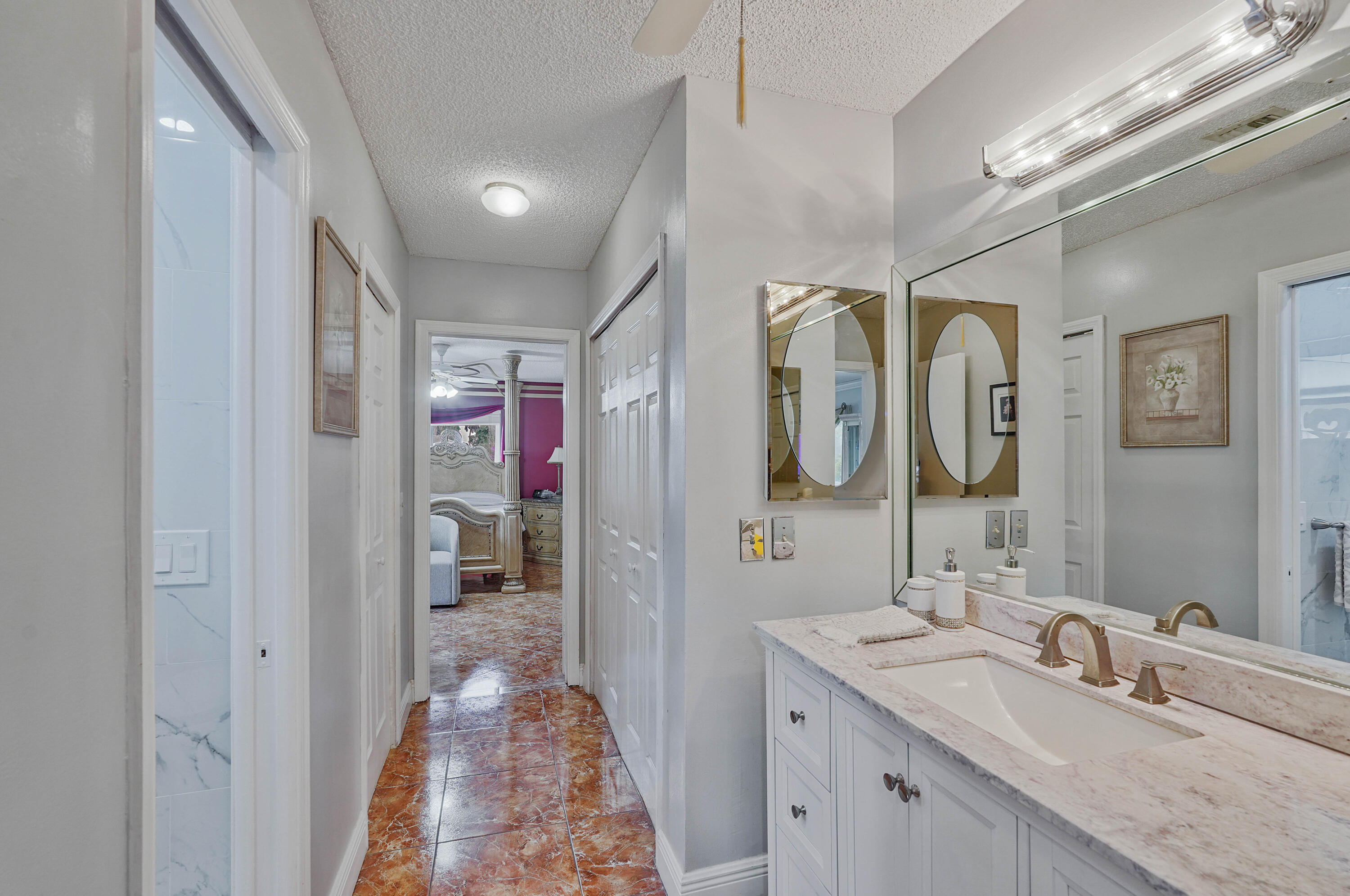 7512 Ace Road North Lake Worth, FL 33467 - Photo 10 of 25 a bathroom with a sink vanity and mirror