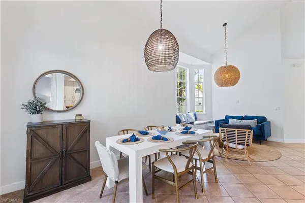 a dining room table chair and a chandelier