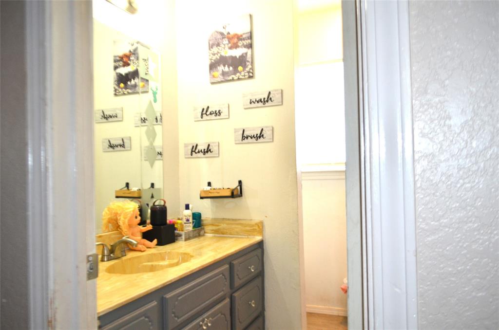 7331 Taylor Ranch Loop Kaufman, TX 75142 - Photo 14 of 34 a view of bathroom with a sink and a window