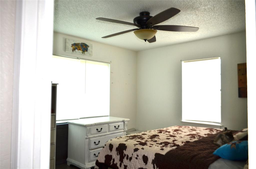 7331 Taylor Ranch Loop Kaufman, TX 75142 - Photo 15 of 34 a bedroom with a bed and a window