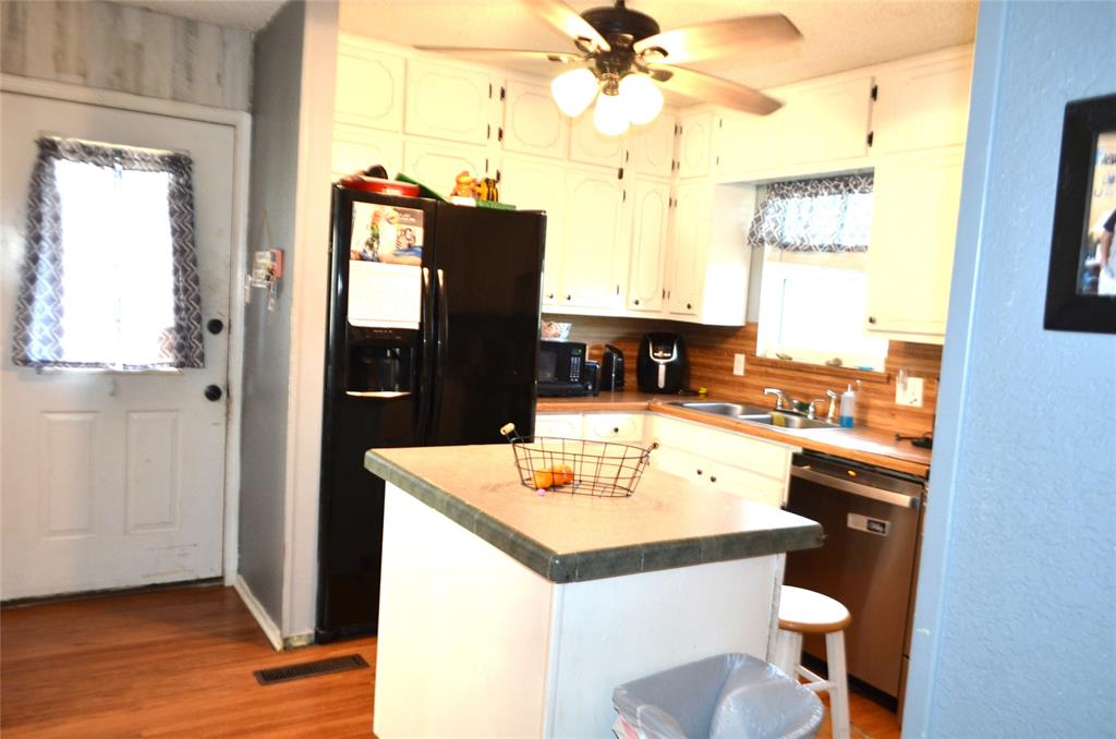 7331 Taylor Ranch Loop Kaufman, TX 75142 - Photo 7 of 34 a bathroom with a sink a mirror and a window