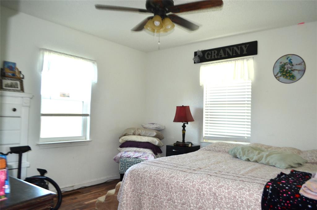7331 Taylor Ranch Loop Kaufman, TX 75142 - Photo 9 of 34 a bedroom with a bed and a window