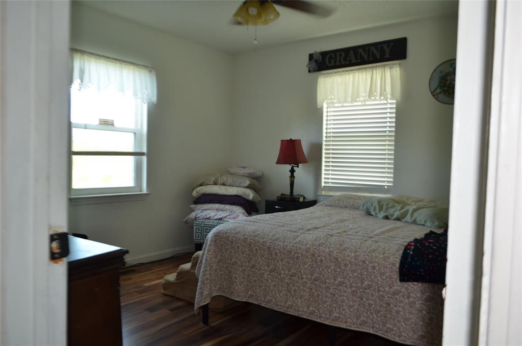 7331 Taylor Ranch Loop Kaufman, TX 75142 - Photo 10 of 34 a bedroom with a bed and a window