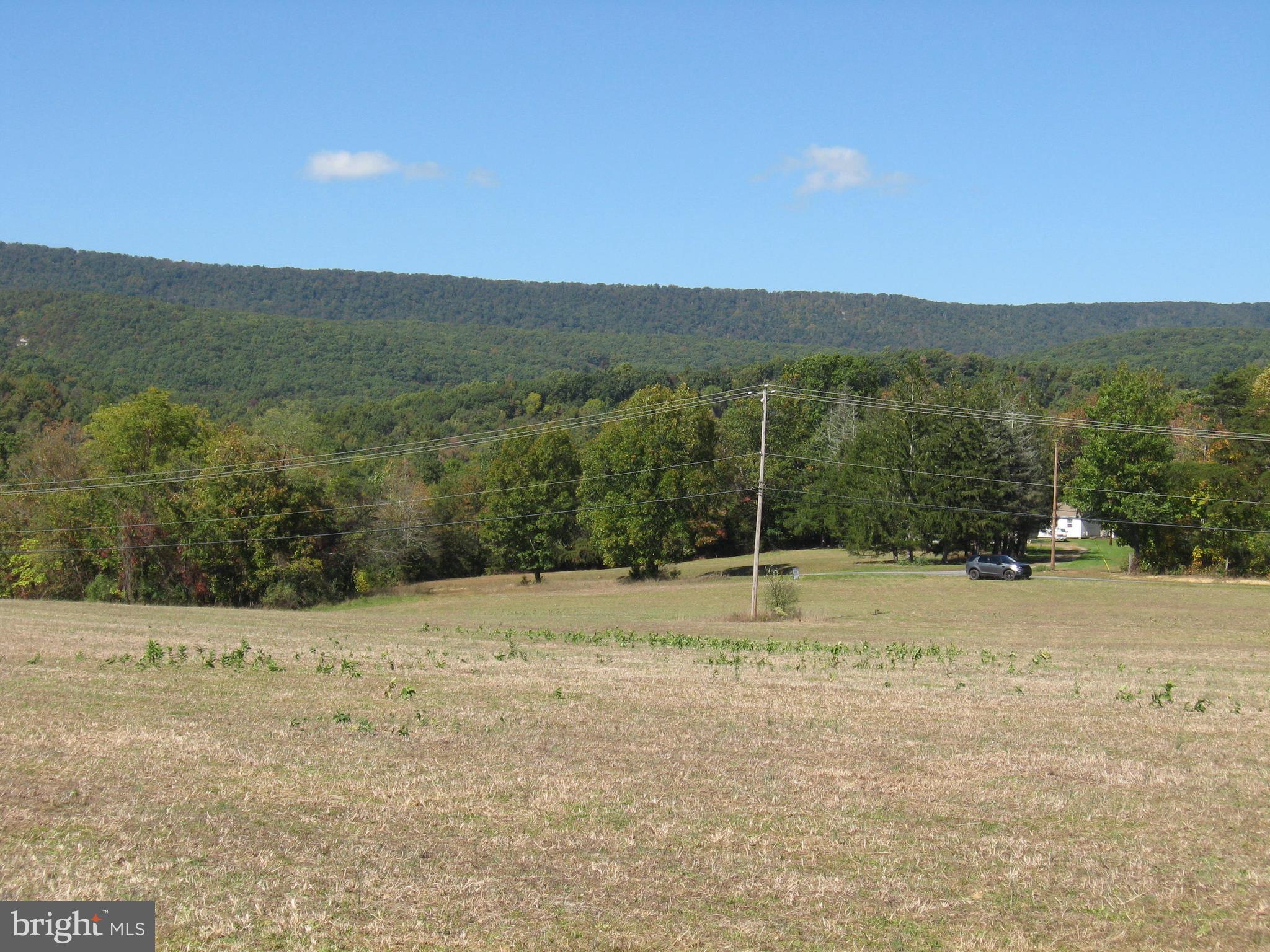 Fish Hatchery Road Berkeley Springs, WV 25411 - Photo 8 of 44 a view of a field with a yard