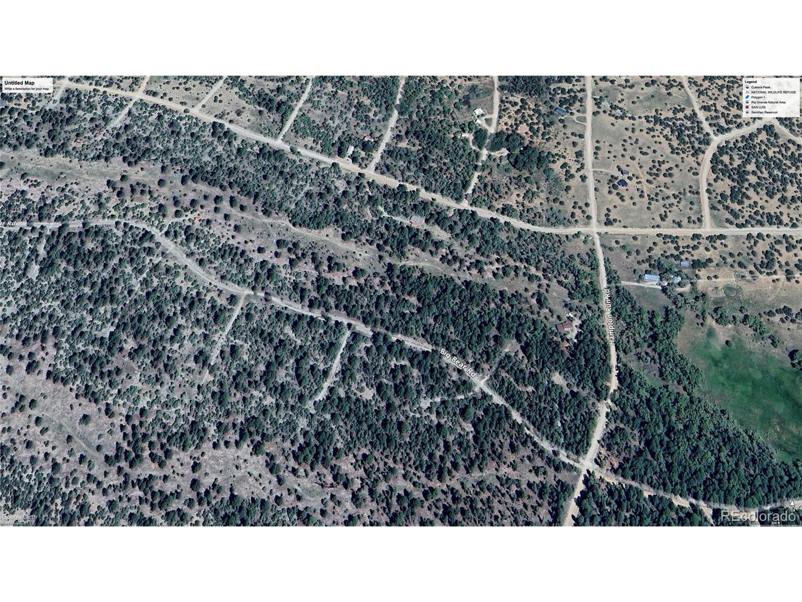 54 Big Bear Road Mosca, CO 81146 - Photo 15 of 16 a open area of a house with a yard