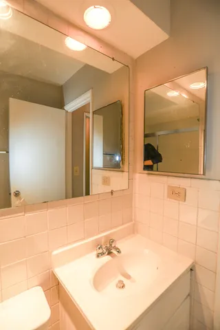 a bathroom with a sink and a mirror