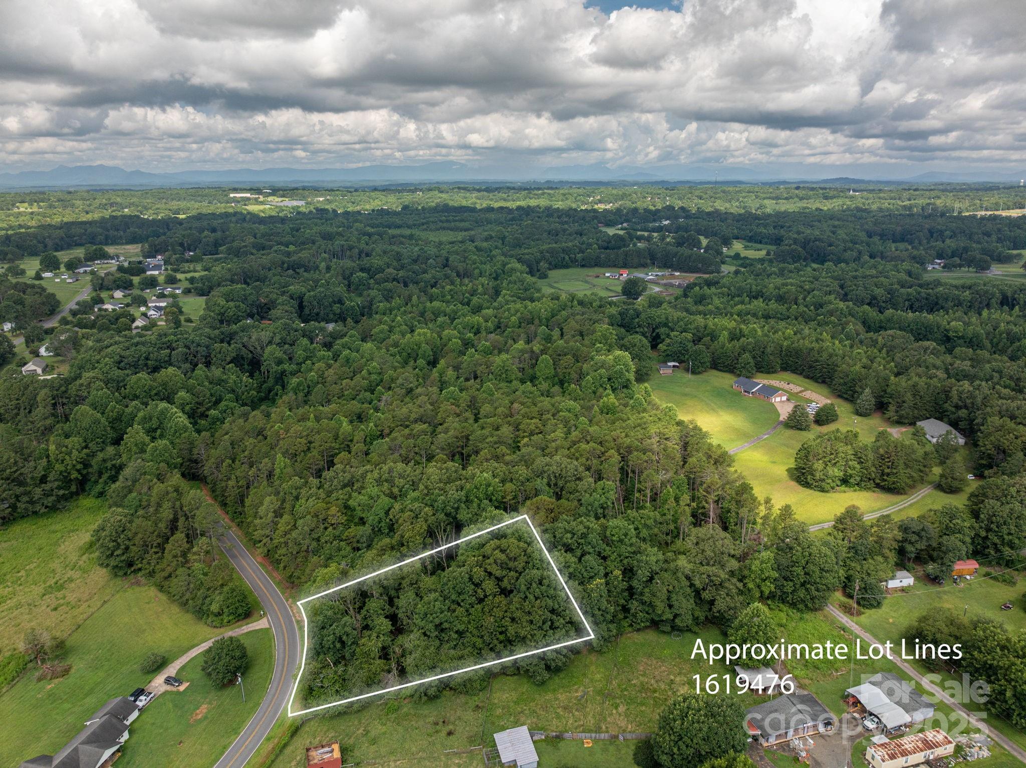 Lot 12 McDade Road Forest City, NC 28043 - Photo 10 of 10 a view of a city with lush green forest