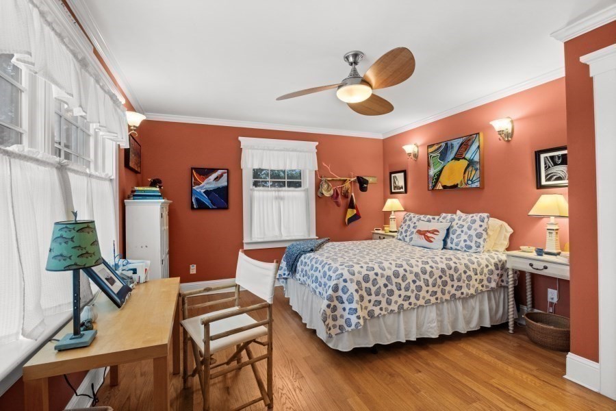 61 Causeway Road Tisbury, MA 02568 - Photo 18 of 42 a bedroom with a bed and wooden floor