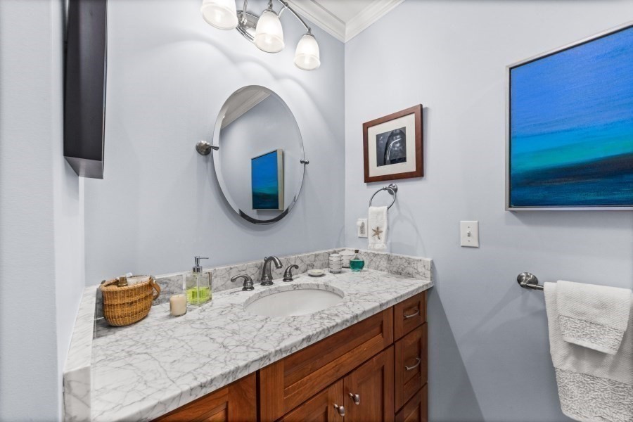 61 Causeway Road Tisbury, MA 02568 - Photo 20 of 42 a bathroom with a granite countertop sink and a mirror