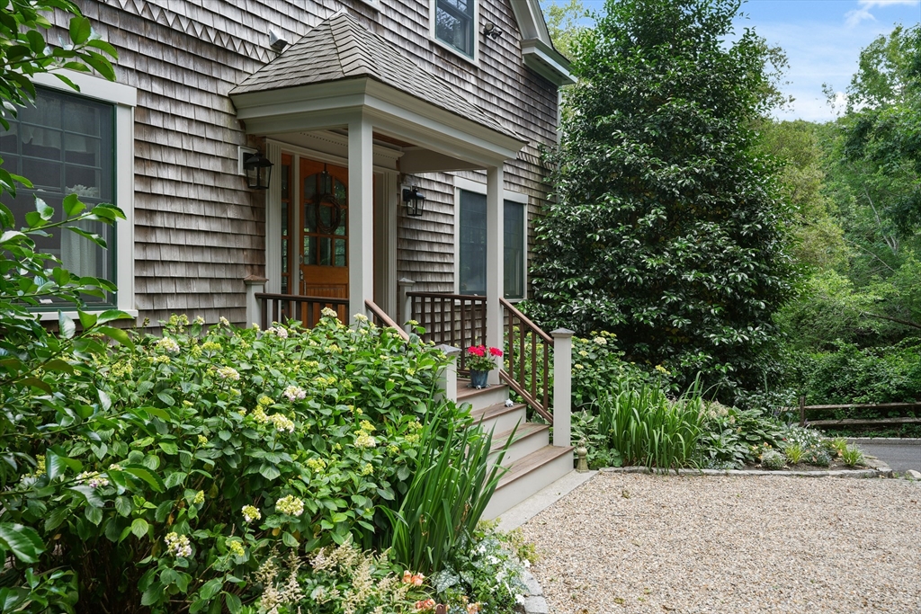 61 Causeway Road Tisbury, MA 02568 - Photo 2 of 42 a view of a house with potted plants