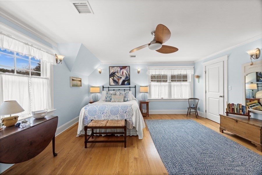 61 Causeway Road Tisbury, MA 02568 - Photo 22 of 42 a bedroom with furniture and a wooden floor