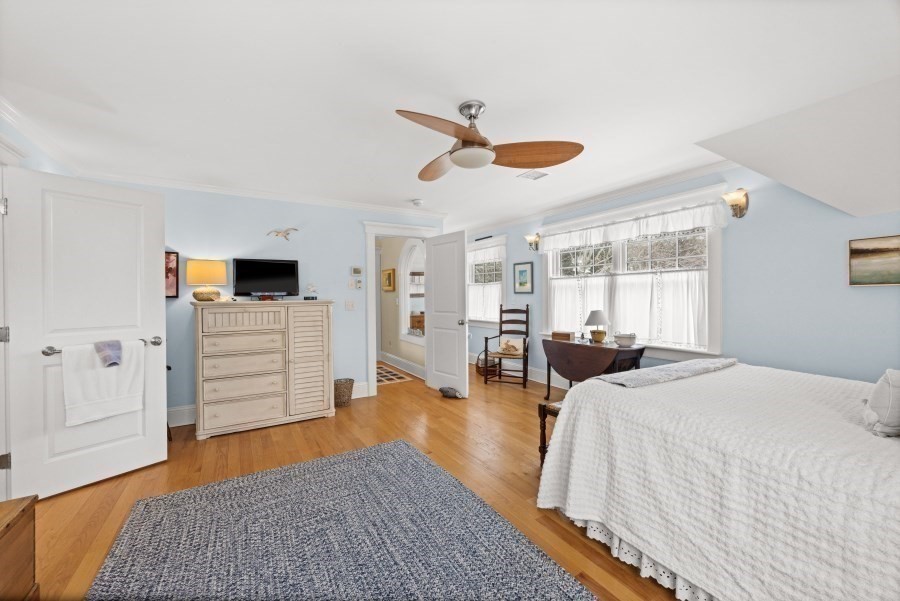 61 Causeway Road Tisbury, MA 02568 - Photo 23 of 42 a bedroom with furniture and a wooden floor
