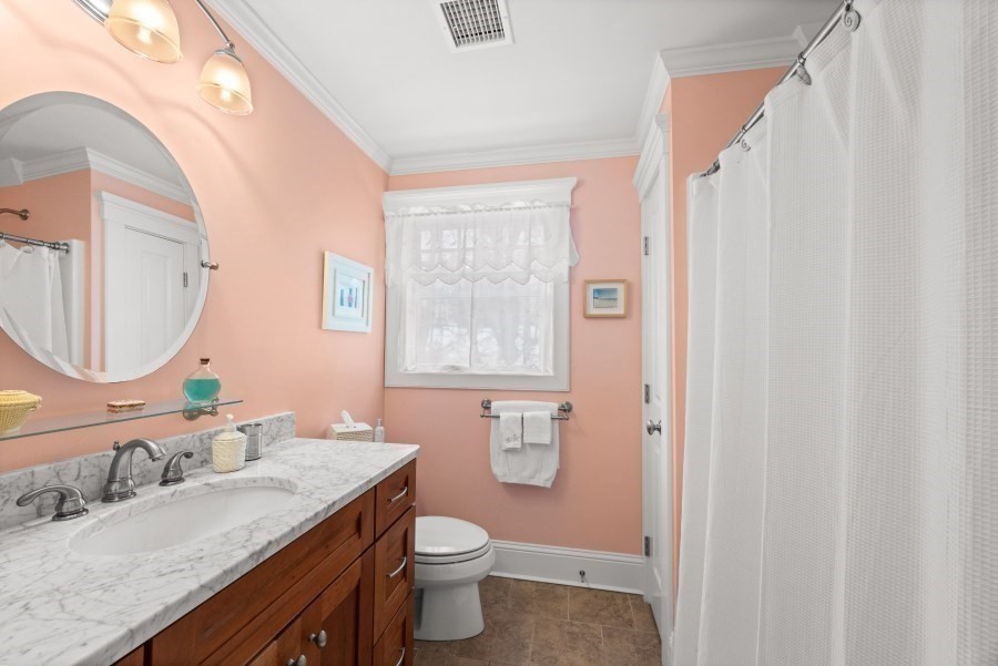 61 Causeway Road Tisbury, MA 02568 - Photo 30 of 42 a bathroom with a granite countertop sink toilet and shower
