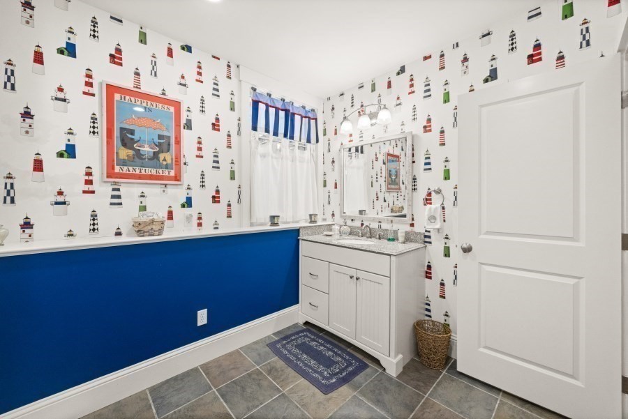 61 Causeway Road Tisbury, MA 02568 - Photo 42 of 42 a bathroom with a sink and a mirror