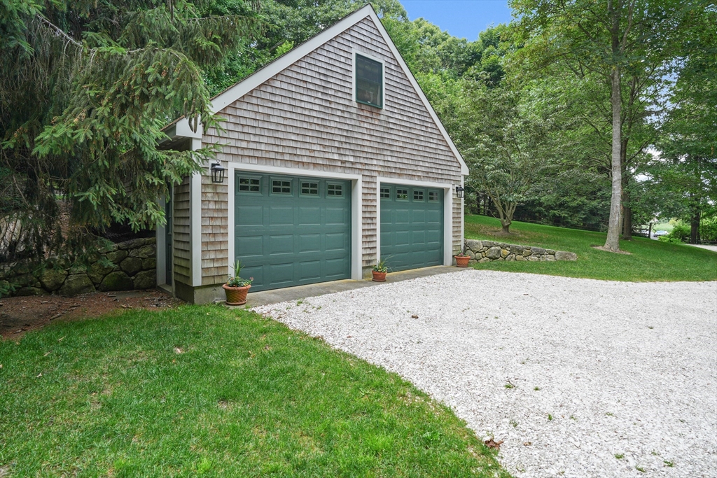 61 Causeway Road Tisbury, MA 02568 - Photo 8 of 42 a view of a house with a yard and large tree