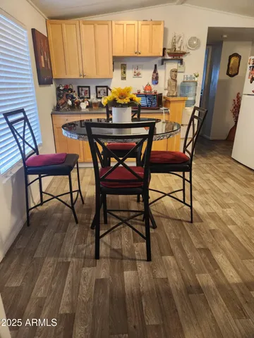 a view of a dining room with furniture and a window