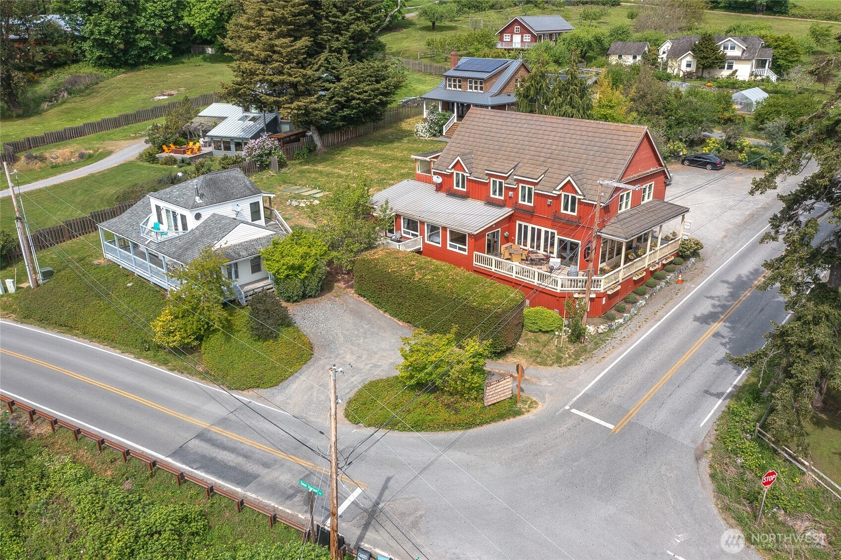 942 Deer Harbor Road Orcas Island, WA 98245 - Photo 36 of 40 an aerial view of a house with a garden and lake view