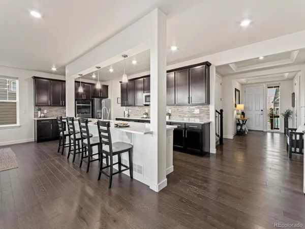 a open kitchen with a table and chairs