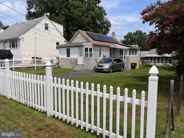 a front view of house with yard and porch