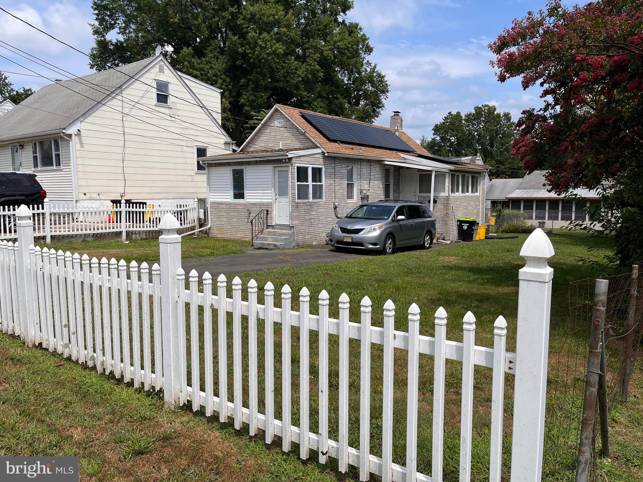 a front view of house with yard and porch