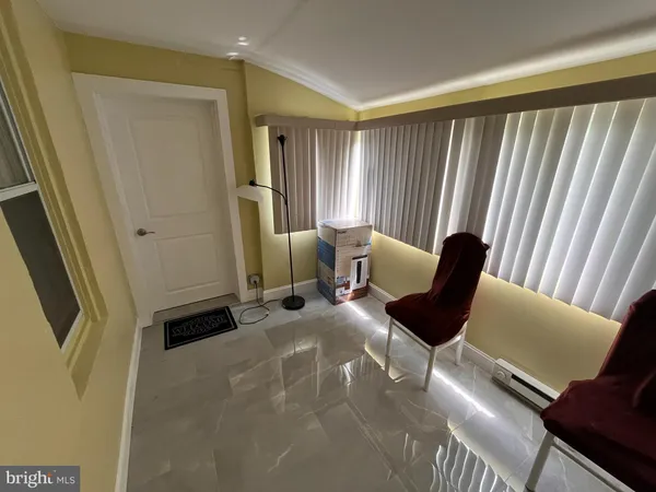 a view of a livingroom with furniture and a window