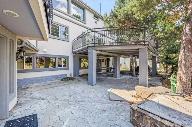 a view of a building with floor to ceiling windows and a basket ball poll