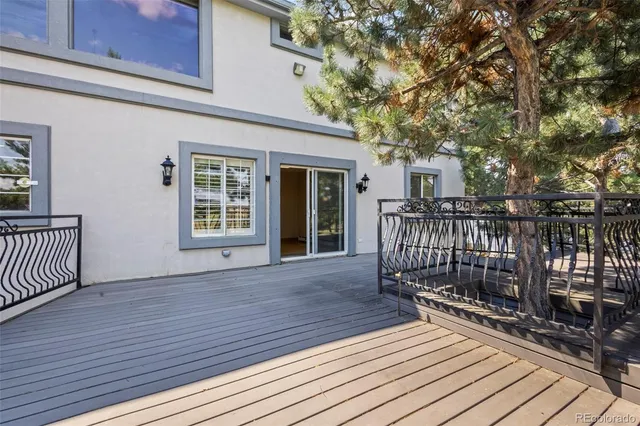 a view of a house with wooden deck