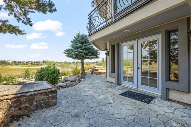 a view of a house with outdoor space and ocean view
