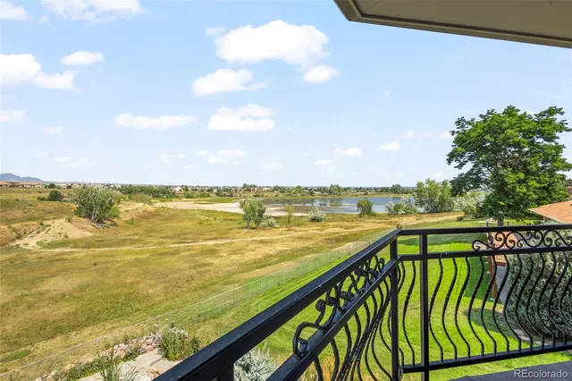a spacious bedroom with a bed and glass door