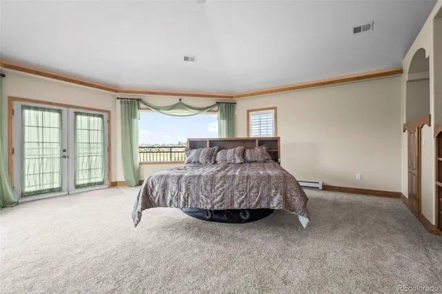 a bed room with a bed and a couch