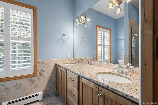 an empty room with wooden floor and furniture