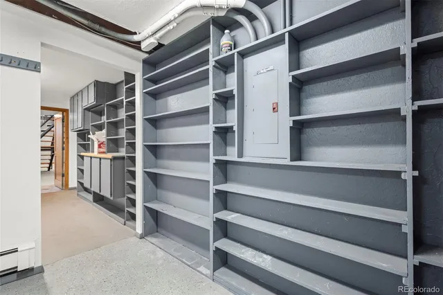 an aerial view of ocean and residential houses with outdoor space