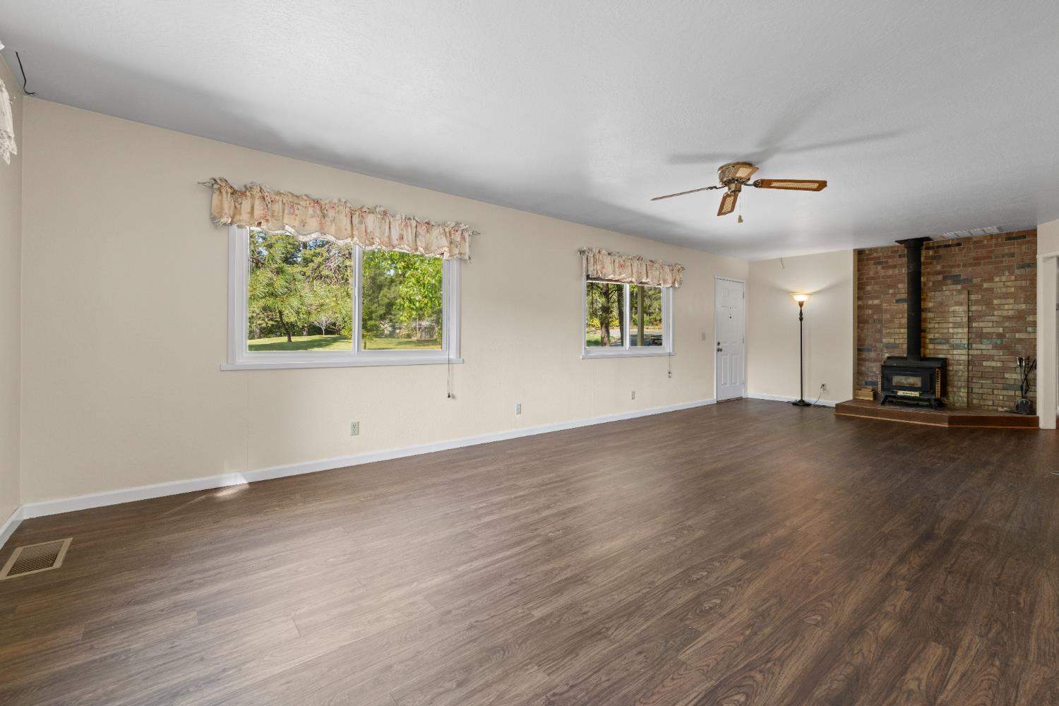 16173 Norlene Way Grass Valley, CA 95949 - Photo 18 of 25 a view of a livingroom with wooden floor and a window
