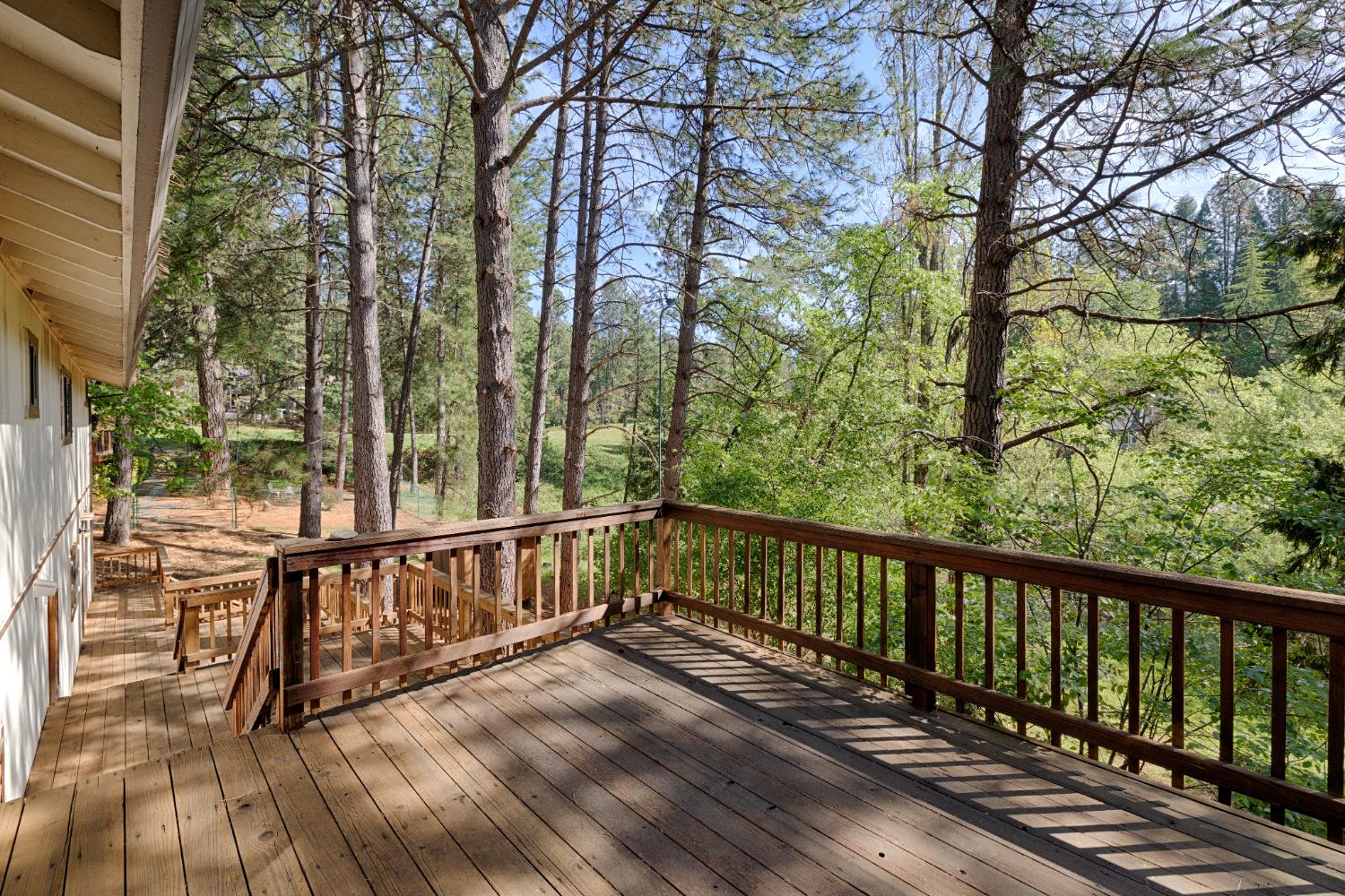 16173 Norlene Way Grass Valley, CA 95949 - Photo 2 of 25 a view of balcony with wooden floor and fence